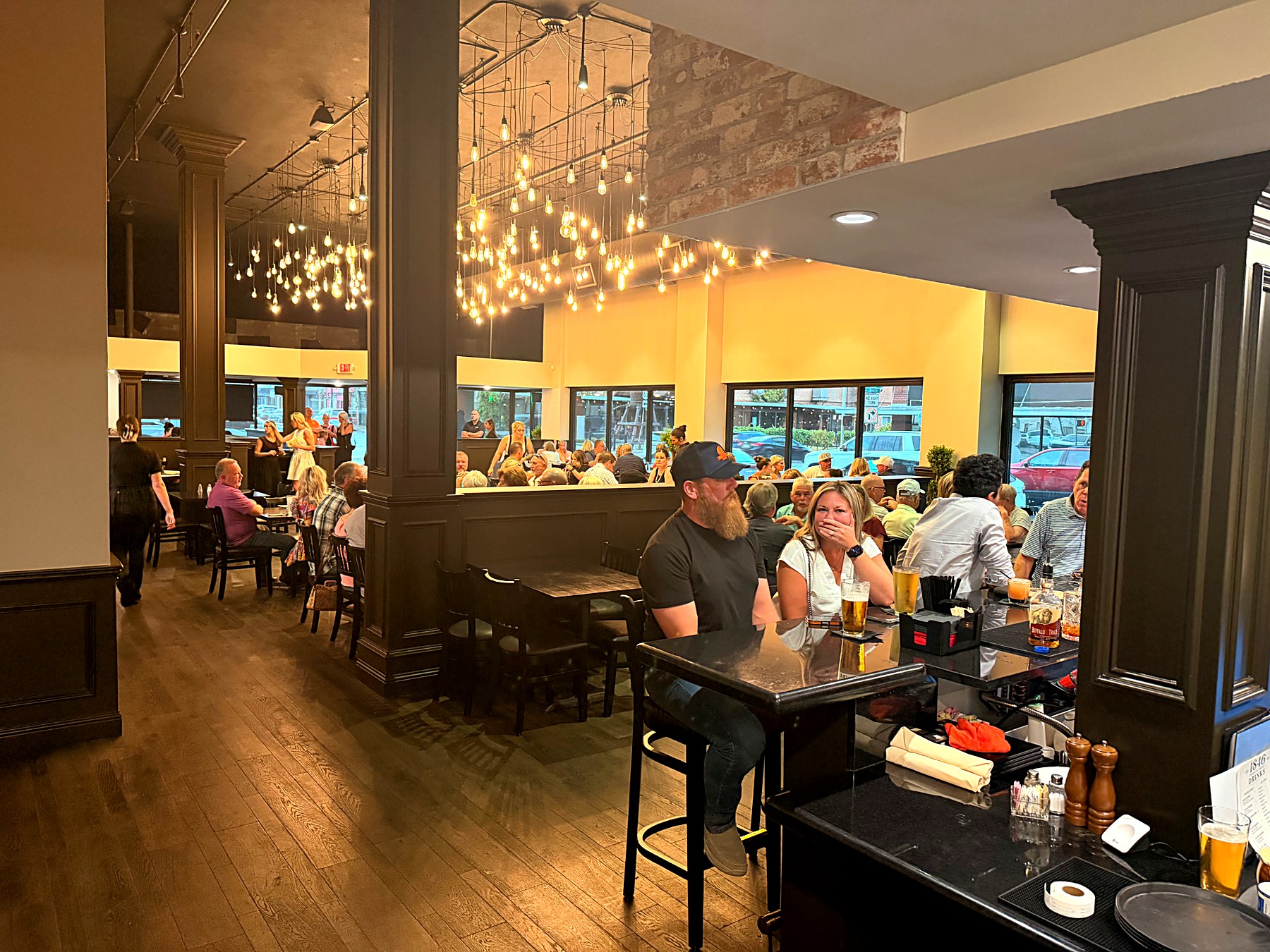 Guests at the bar inside 1846 in downtown Greenville